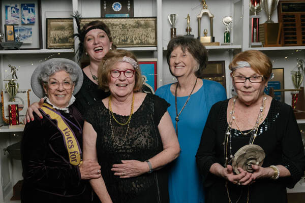 Current and past presidents pose with members at the 2020 Suffragist Shuffle