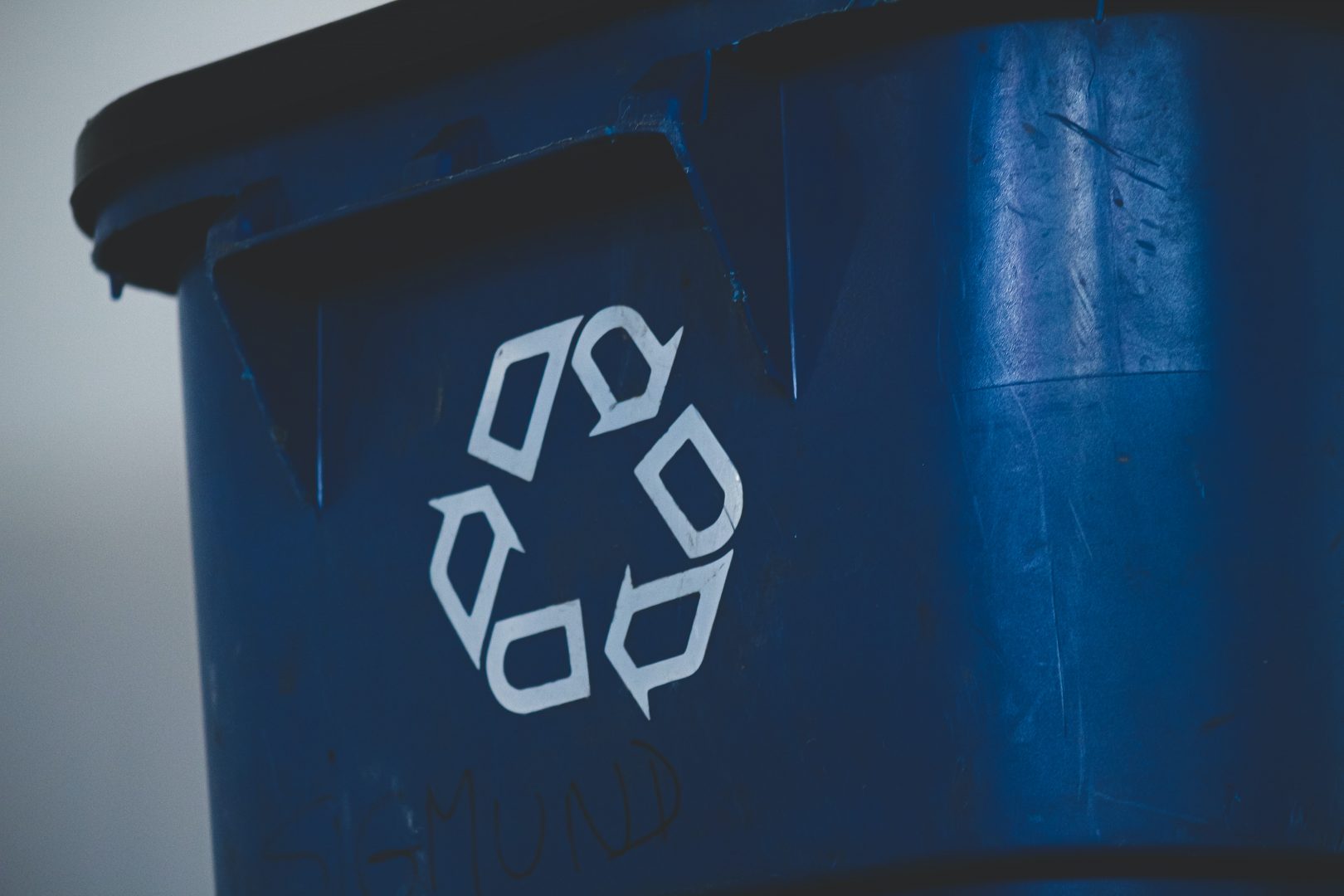 Dark blue recycling bin.